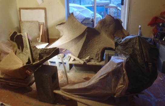 Areas are kept wrapped in plastic to keep the drying even. When you add new clay you need to allow time for the water to re-balance itself down the form. A large piece will be holding gallons of water.